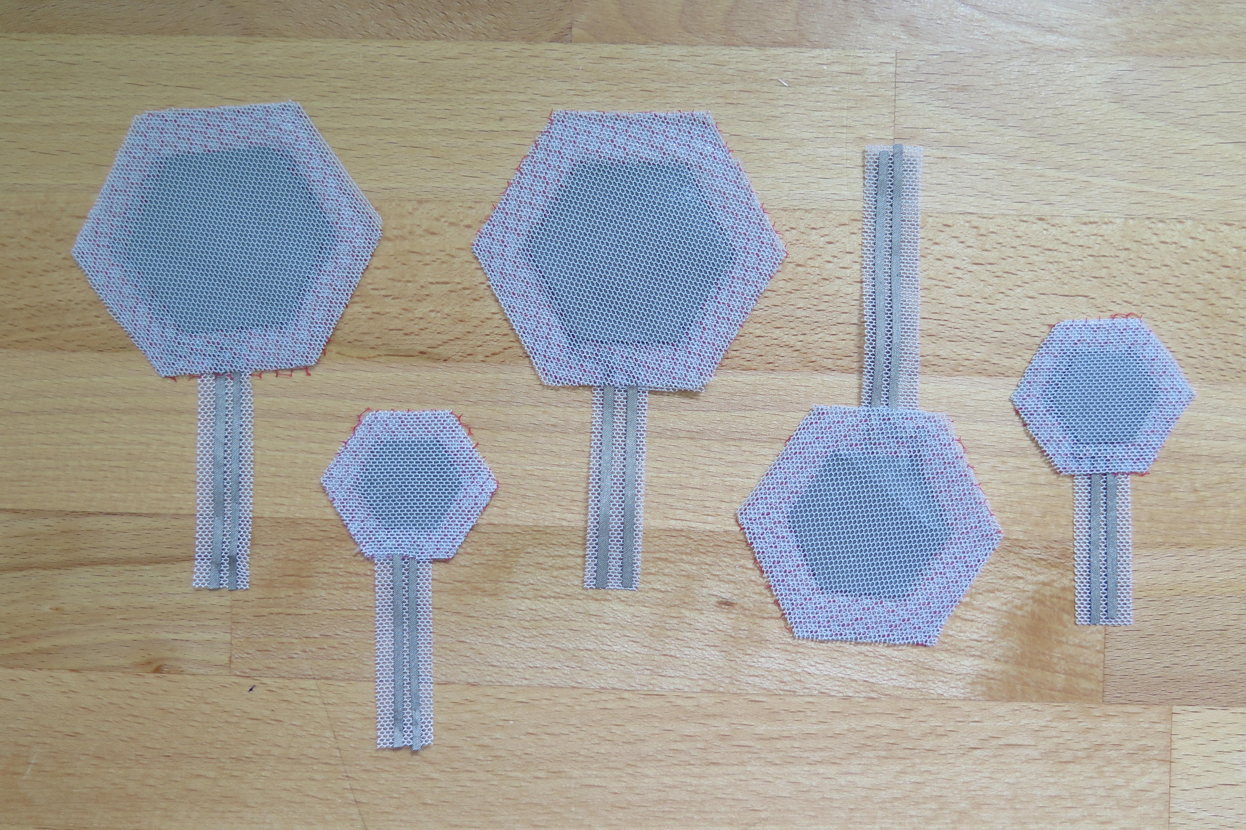 Different sizes of finished switch patches of 1 to 1.75 inches in diameter